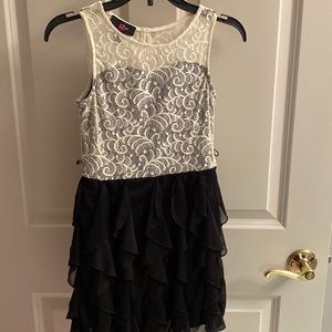 Beautiful girl holiday dress. Cream lace top with black ruffle bottom. Worn once